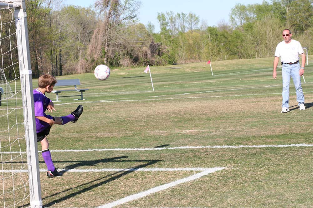 Kid Kicking a Soccer Ball