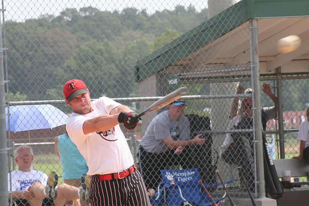 Adult Hitting a Softball