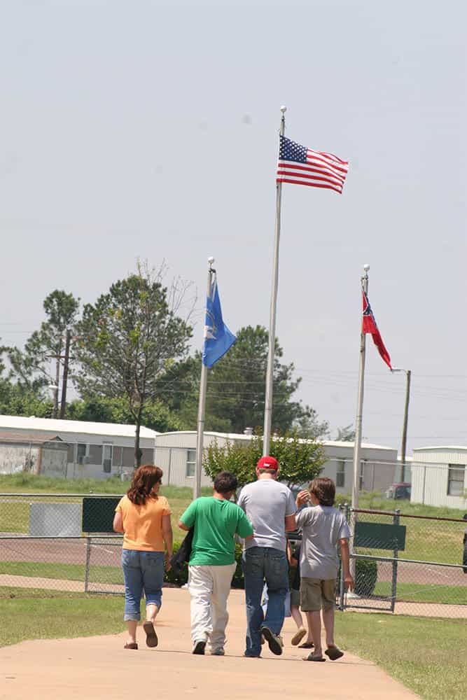 Group Leaving a Gated Area