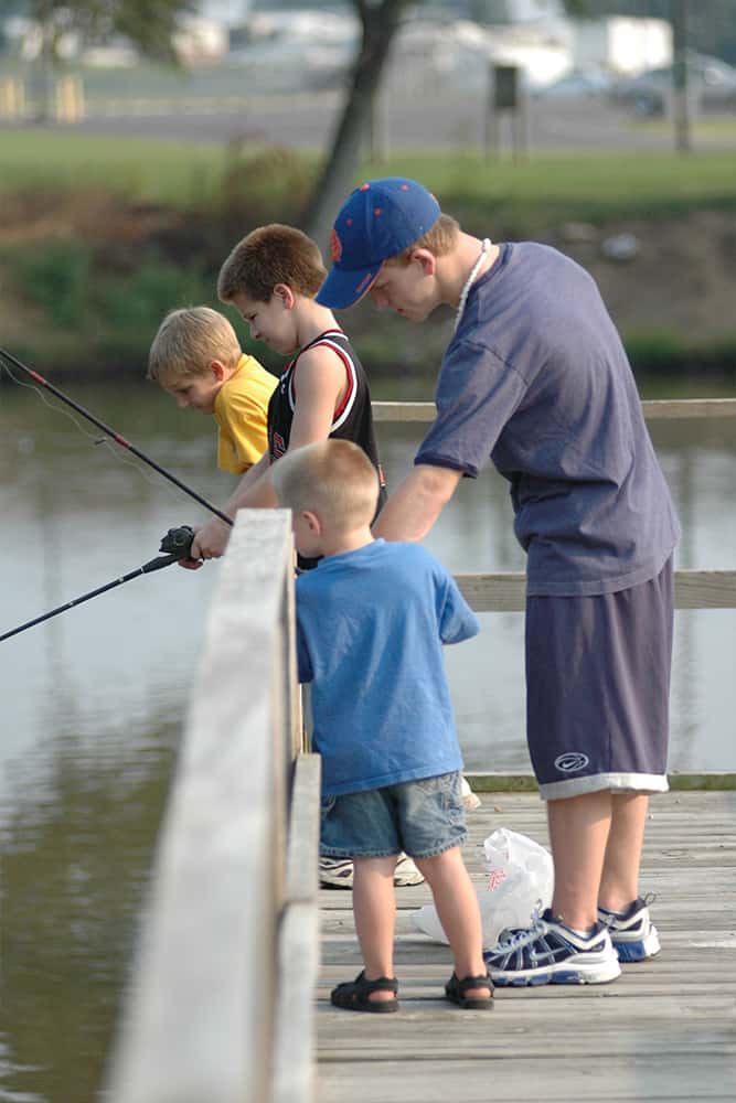 Kids Fishing off a Dock